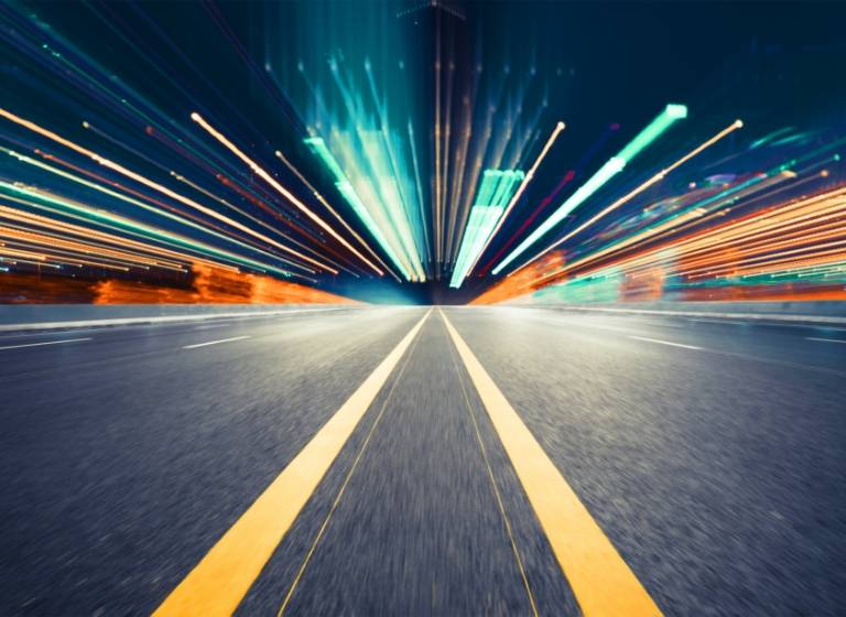 Low shot of double yellow road line