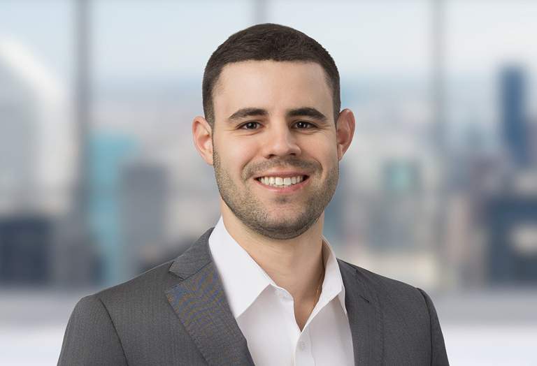 Jason Hanerfeld, Director in front of a soft focus architectural background